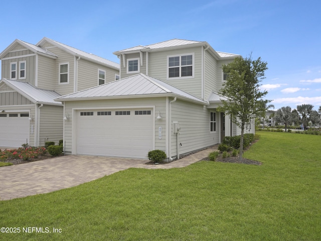 471 Rum Runner Way, Saint Johns, FL 32259 - view of front of home featuring decorative driveway, a front yard, a standing seam roof, and metal roof