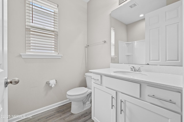 618 Honeycomb Trl, Saint Augustine, FL 32095 - full bathroom featuring baseboards, toilet, wood finished floors, and vanity