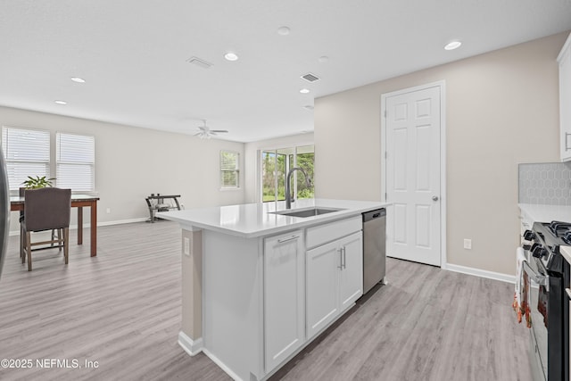 618 Honeycomb Trl, Saint Augustine, FL 32095 - kitchen with a sink, stainless steel appliances, light wood-style floors, light countertops, and baseboards