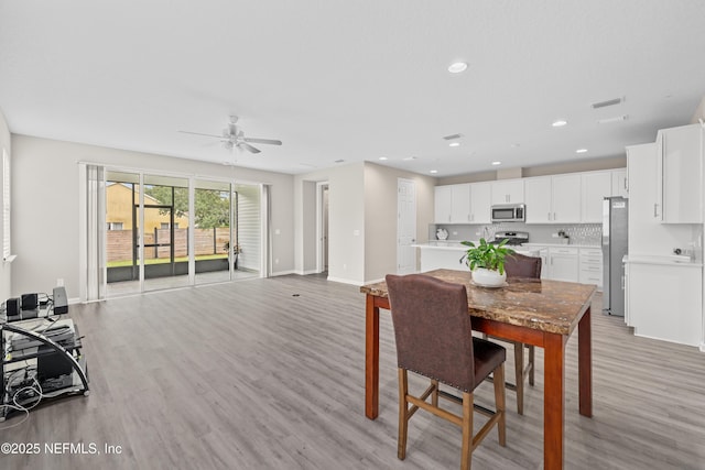 618 Honeycomb Trl, Saint Augustine, FL 32095 - dining room featuring light wood-type flooring, a ceiling fan, baseboards, and recessed lighting