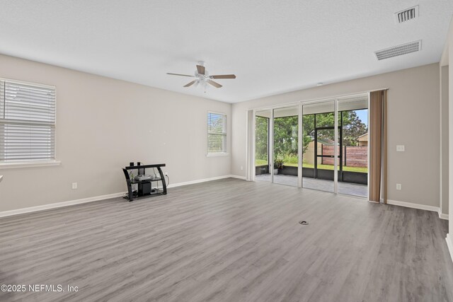618 Honeycomb Trl, Saint Augustine, FL 32095 - unfurnished room with a ceiling fan, wood finished floors, and baseboards