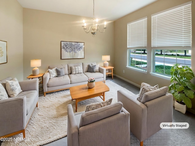 carpeted living room featuring a chandelier and baseboards