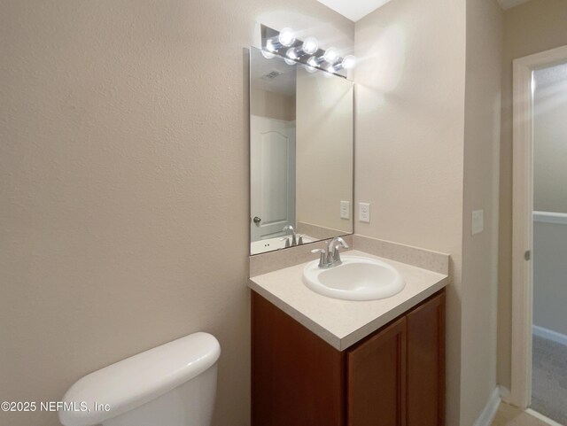 half bath with vanity and toilet