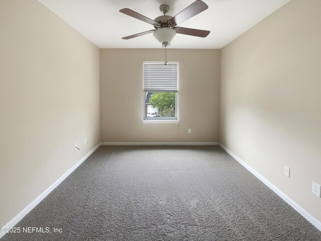 empty room featuring carpet, a ceiling fan, and baseboards