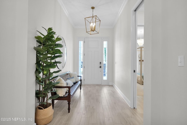 111 Bucktail Ave, Ponte Vedra, FL 32081 - entrance foyer with ornamental molding, a chandelier, light wood finished floors, and baseboards