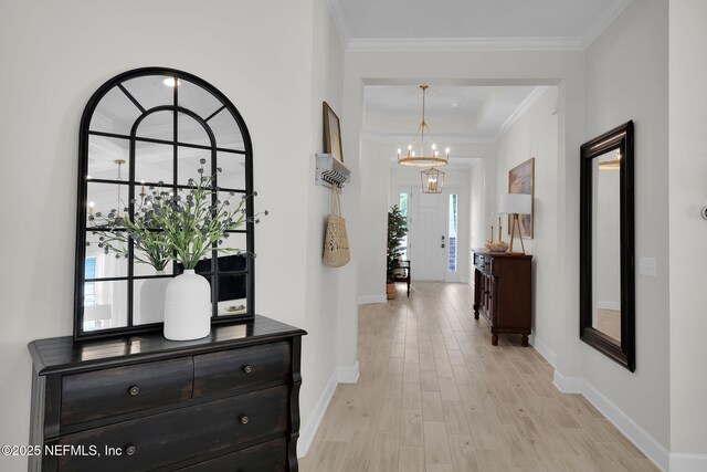111 Bucktail Ave, Ponte Vedra, FL 32081 - entryway with a chandelier, light wood finished floors, baseboards, and ornamental molding