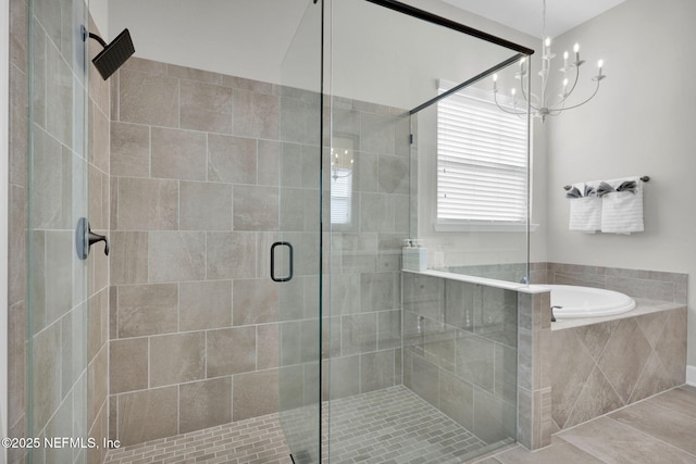 111 Bucktail Ave, Ponte Vedra, FL 32081 - full bathroom with a garden tub, a stall shower, and a chandelier