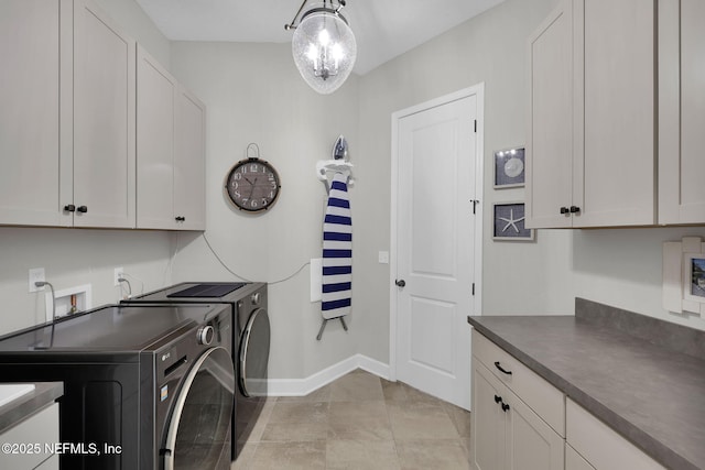 111 Bucktail Ave, Ponte Vedra, FL 32081 - laundry area with washer and clothes dryer, cabinet space, baseboards, and light tile patterned floors