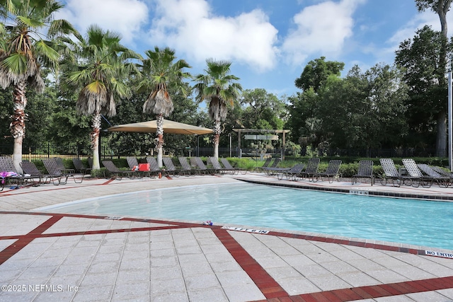 111 Bucktail Ave, Ponte Vedra, FL 32081 - community pool featuring a patio and view of wooded area