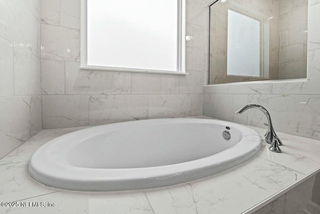 bathroom with a garden tub
