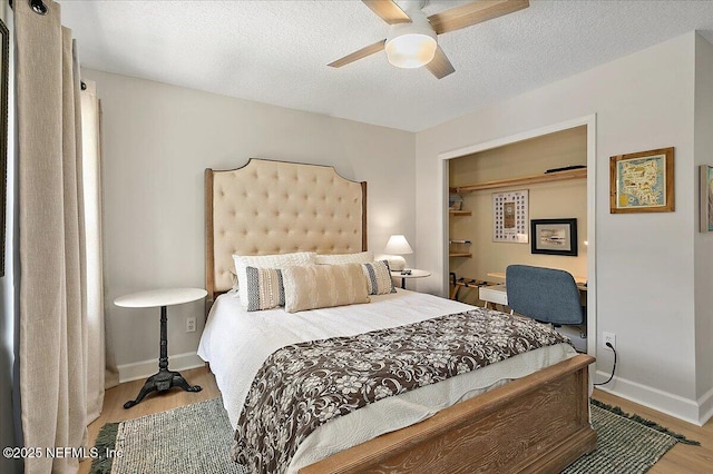 12768 Cattail Pond Cir S, Jacksonville, FL 32224 - bedroom featuring wood finished floors, baseboards, a textured ceiling, and a ceiling fan