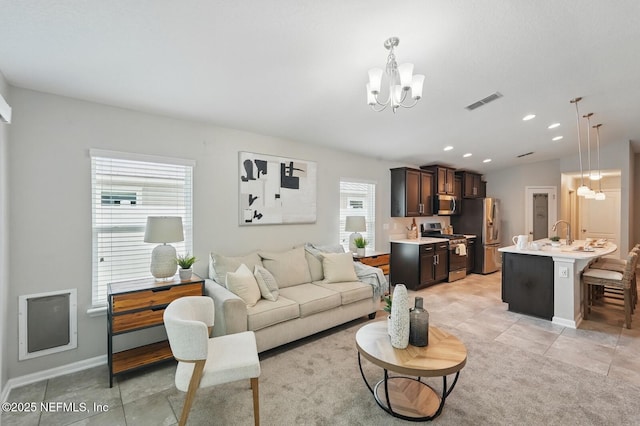 481 Fox Water Trl, Saint Augustine, FL 32086 - living area featuring a chandelier, light tile patterned flooring, baseboards, and recessed lighting