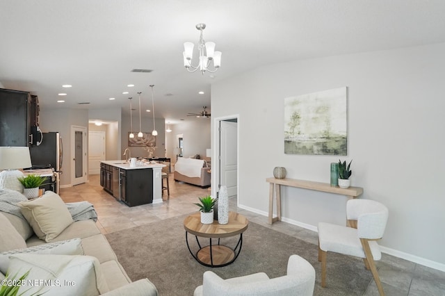 481 Fox Water Trl, Saint Augustine, FL 32086 - living area with a chandelier, recessed lighting, baseboards, light tile patterned flooring, and a ceiling fan