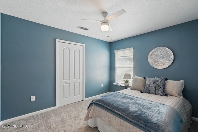 481 Fox Water Trl, Saint Augustine, FL 32086 - carpeted bedroom featuring a textured ceiling, baseboards, and a ceiling fan
