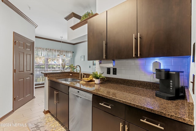 10961 Burnt Mill Rd Unit 1311, Jacksonville, FL 32256 - kitchen featuring stainless steel dishwasher, a sink, crown molding, tasteful backsplash, and dark stone countertops