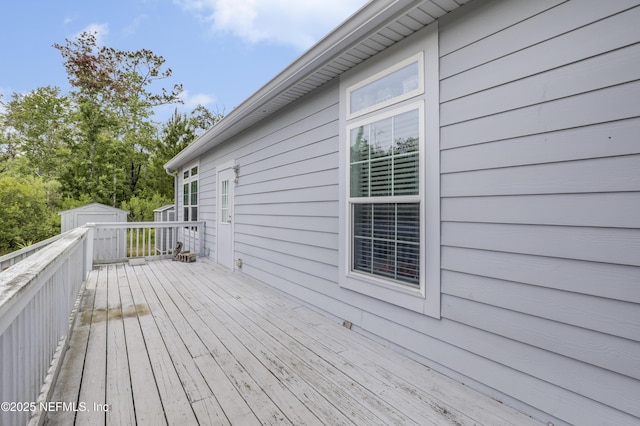 4824 Stephen St, Hastings, FL 32145 - wooden terrace featuring a storage unit and an outbuilding