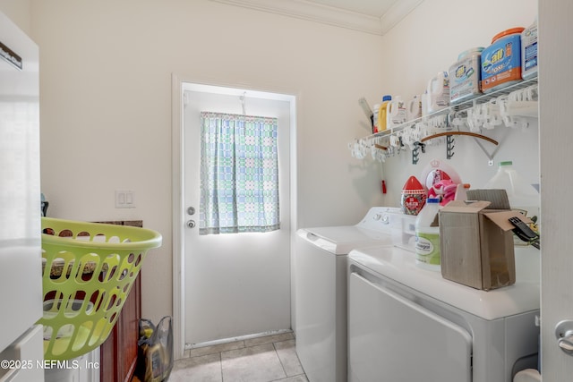 4824 Stephen St, Hastings, FL 32145 - clothes washing area featuring washer and clothes dryer, ornamental molding, and light tile patterned flooring