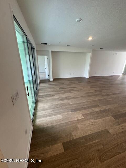 317 Archstone Way, Saint Augustine, FL 32092 - spare room with wood finished floors, baseboards, and recessed lighting
