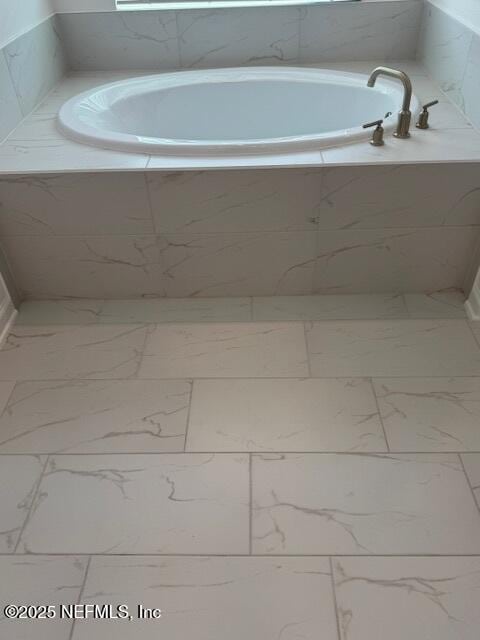 317 Archstone Way, Saint Augustine, FL 32092 - full bathroom with marble look tiles and a bath