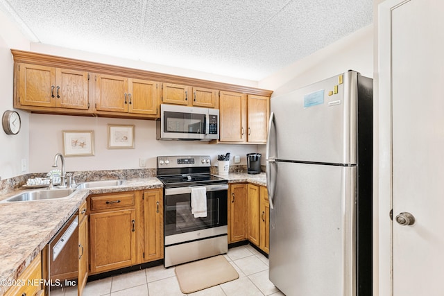 8550 A1A S Unit 14151, Saint Augustine, FL 32080 - kitchen featuring stainless steel appliances, a sink, light countertops, and a textured ceiling
