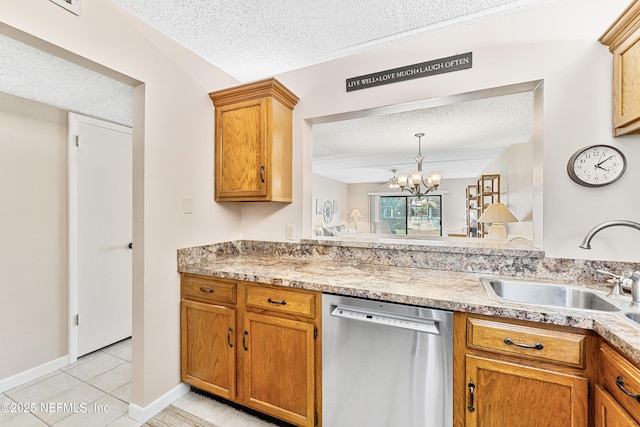 8550 A1A S Unit 14151, Saint Augustine, FL 32080 - kitchen featuring dishwasher, a sink, a textured ceiling, light tile patterned flooring, and a chandelier