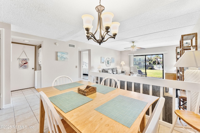 8550 A1A S Unit 14151, Saint Augustine, FL 32080 - dining area with ceiling fan, a chandelier, light tile patterned flooring, and a textured ceiling
