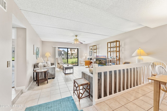 8550 A1A S Unit 14151, Saint Augustine, FL 32080 - tiled living area featuring a ceiling fan and a textured ceiling