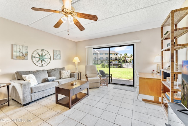 8550 A1A S Unit 14151, Saint Augustine, FL 32080 - living room featuring light tile patterned floors, a ceiling fan, and a textured ceiling