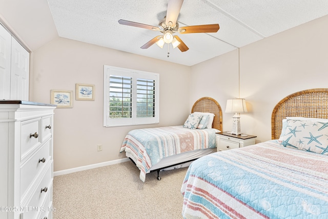 8550 A1A S Unit 14151, Saint Augustine, FL 32080 - bedroom featuring baseboards, vaulted ceiling, carpet floors, and a ceiling fan