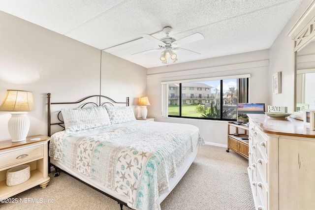 8550 A1A S Unit 14151, Saint Augustine, FL 32080 - carpeted bedroom featuring ceiling fan, a textured ceiling, and baseboards