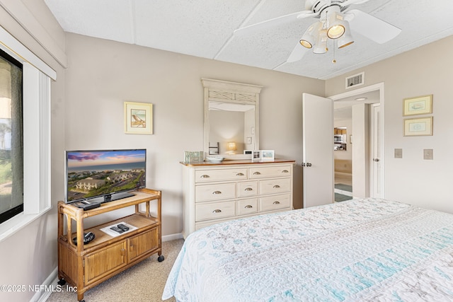 8550 A1A S Unit 14151, Saint Augustine, FL 32080 - carpeted bedroom featuring baseboards and ceiling fan