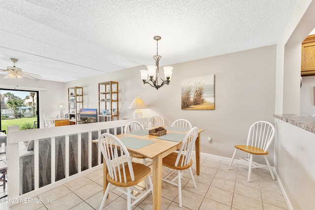 8550 A1A S Unit 14151, Saint Augustine, FL 32080 - dining space with light tile patterned flooring, a textured ceiling, a chandelier, and a ceiling fan
