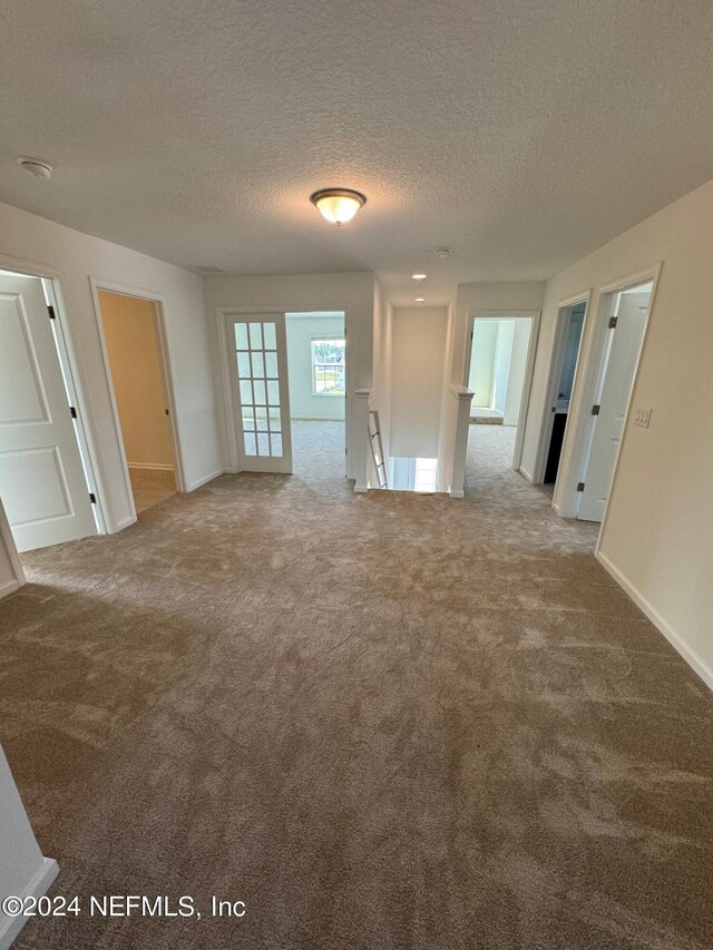 150 Iris Landing Dr, Saint Augustine, FL 32092 - carpeted empty room featuring a textured ceiling and baseboards