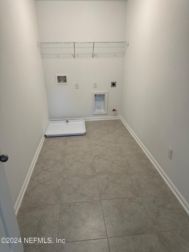 150 Iris Landing Dr, Saint Augustine, FL 32092 - clothes washing area featuring hookup for a gas dryer, hookup for a washing machine, hookup for an electric dryer, and baseboards