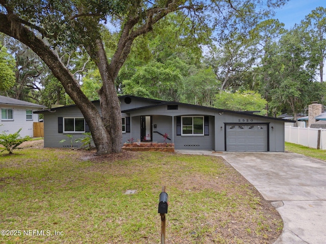 2520 Elbow Rd, Orange Park, FL 32073 - ranch-style home with covered porch, a garage, and concrete driveway