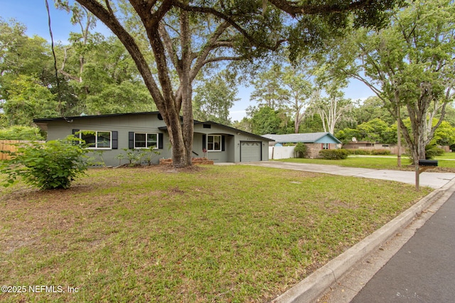 2520 Elbow Rd, Orange Park, FL 32073 - mid-century home featuring driveway and a garage