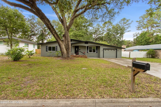 2520 Elbow Rd, Orange Park, FL 32073 - view of front facade with driveway, an attached garage, and a porch