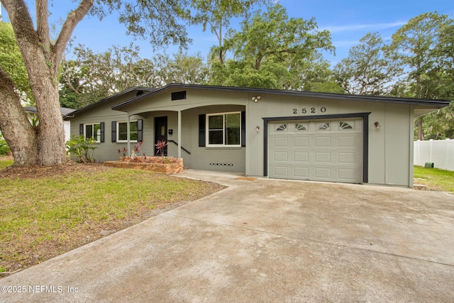 2520 Elbow Rd, Orange Park, FL 32073 - view of front of home featuring concrete driveway, a garage, and covered porch