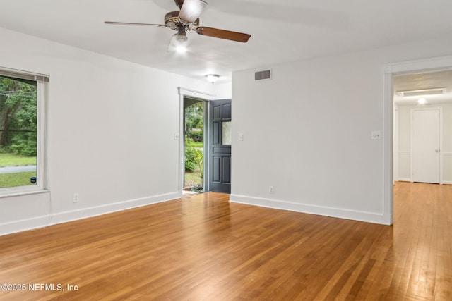2520 Elbow Rd, Orange Park, FL 32073 - empty room with ceiling fan, plenty of natural light, light wood finished floors, and baseboards