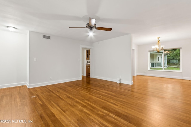 2520 Elbow Rd, Orange Park, FL 32073 - unfurnished living room with a chandelier, wood finished floors, ceiling fan, and baseboards