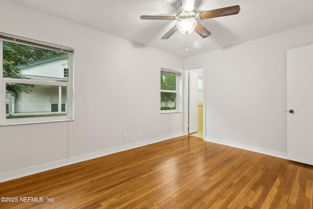 2520 Elbow Rd, Orange Park, FL 32073 - spare room with healthy amount of natural light, wood finished floors, and baseboards