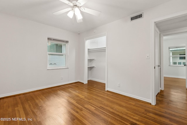 2520 Elbow Rd, Orange Park, FL 32073 - unfurnished bedroom with wood finished floors, baseboards, and ceiling fan