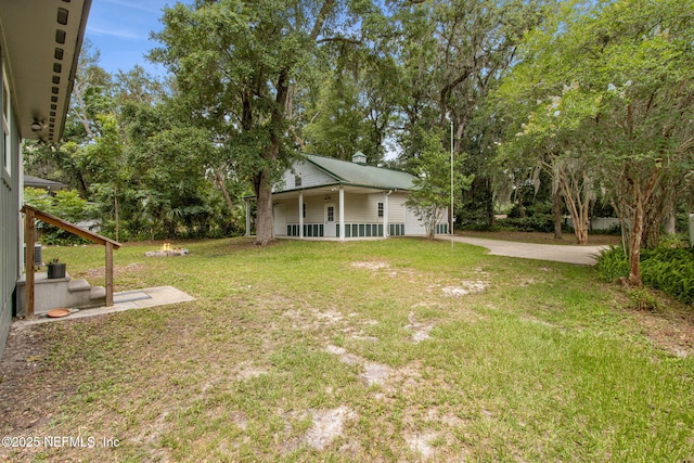 2520 Elbow Rd, Orange Park, FL 32073 - view of green lawn featuring concrete driveway