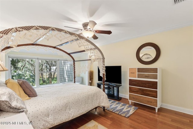 3429 Sea Marsh Rd, Fernandina Beach, FL 32034 - bedroom with baseboards, crown molding, wood finished floors, and ceiling fan