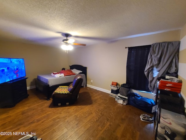 8741 Whispering Pines Dr, Jacksonville, FL 32244 - bedroom featuring wood finished floors, a textured ceiling, ceiling fan, and baseboards