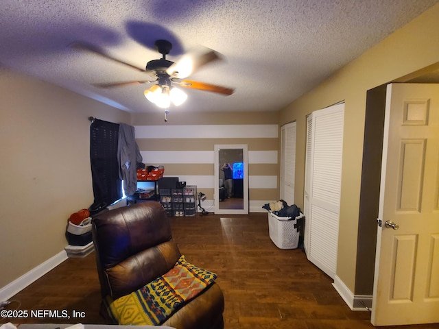 8741 Whispering Pines Dr, Jacksonville, FL 32244 - living area featuring a ceiling fan, wood finished floors, a textured ceiling, and baseboards