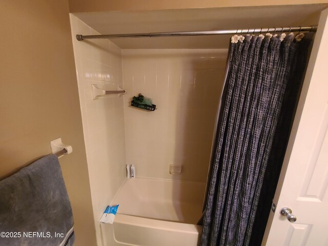 8741 Whispering Pines Dr, Jacksonville, FL 32244 - bathroom with shower / bath combo with shower curtain
