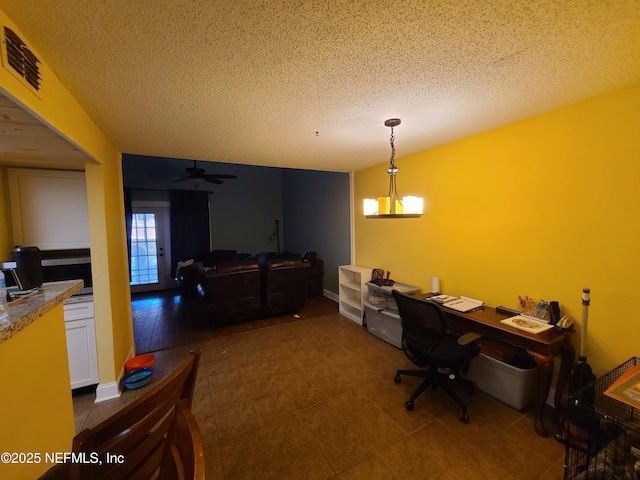 8741 Whispering Pines Dr, Jacksonville, FL 32244 - home office featuring a textured ceiling and a ceiling fan
