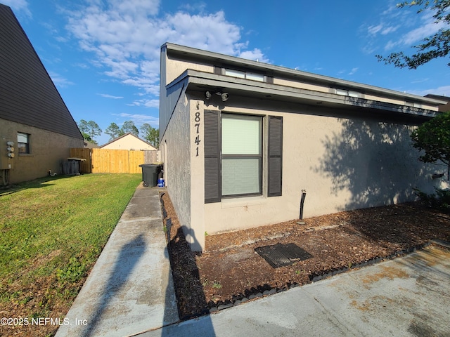 8741 Whispering Pines Dr, Jacksonville, FL 32244 - view of property exterior featuring stucco siding