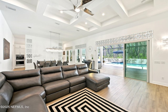 210 Terra Oaks Dr, Saint Johns, FL 32259 - living area featuring coffered ceiling, ceiling fan, wood finished floors, baseboards, and beamed ceiling